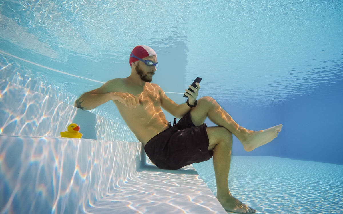 Man addicted to smart phone activity 7 best apps for pool owners
