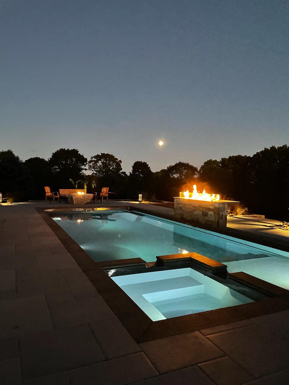March 2023 POM Pic 6 A fiberglass inground swimming pool with night illumination