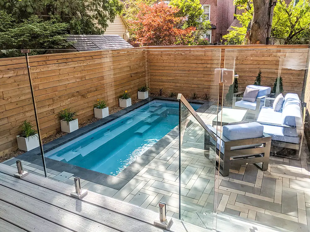 060223SmallPools-2 Discover the perfect fiberglass swimming pool solution for a compact backyard