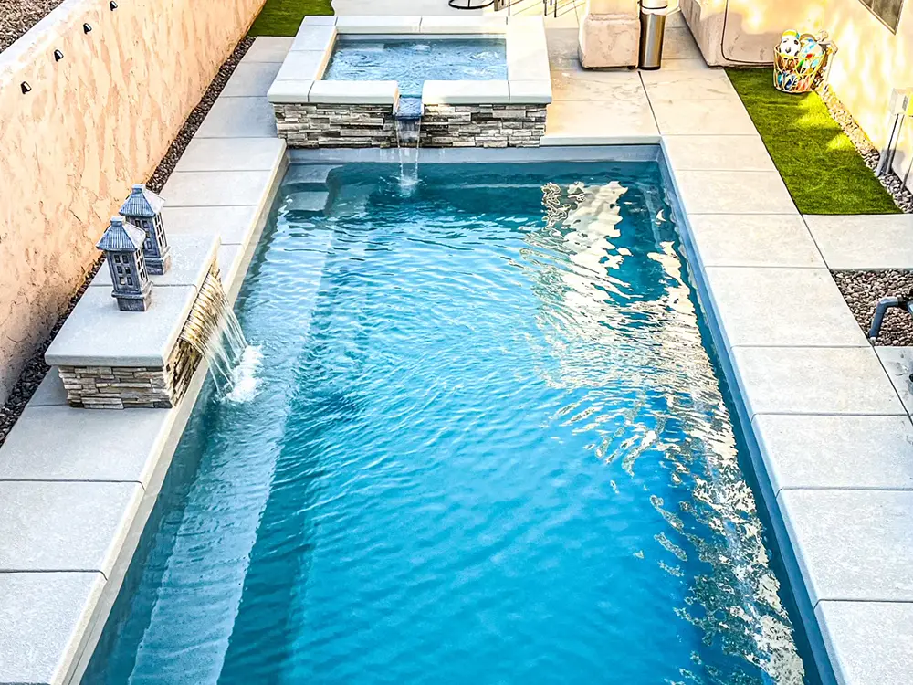 062923-LeisurePoolofMonth-3 A stunning fiberglass backyard pool that complements this backyard.