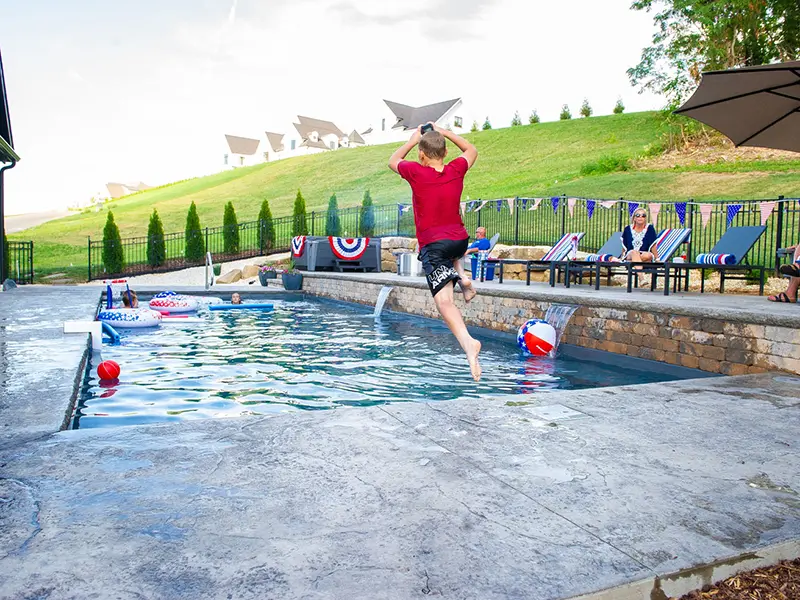 121922-LPPooloftheMonth-4 Leisure Pools Pinnacle 40 fiberglass inground swimming pool in Graphite Gray