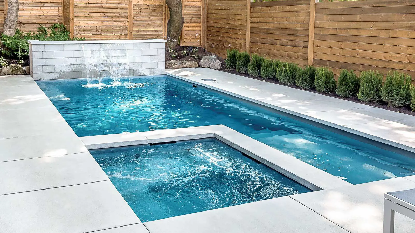 Leisure-Pools-Limitless-Fiberglass-Swimming-Pool Leisure Pools Limitless rectangular fiberglass swimming pool with built-in spa and splash deck