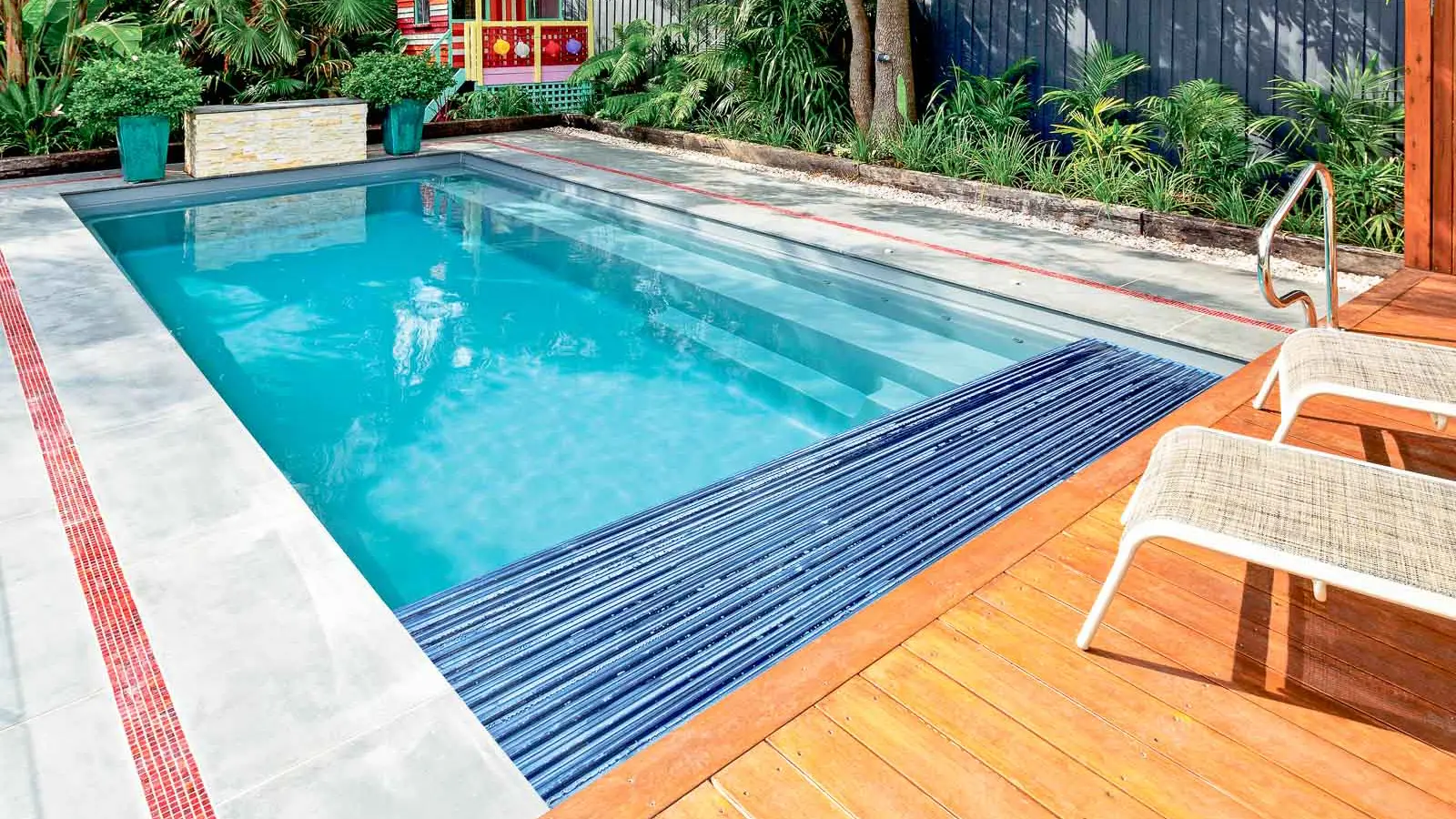 Leisure-Pools-Reflection-plus-Cover-Box-fiberglass-pool The Reflection plus Cover Box, a fiberglass pool with full-length bench seating and built-in cover box