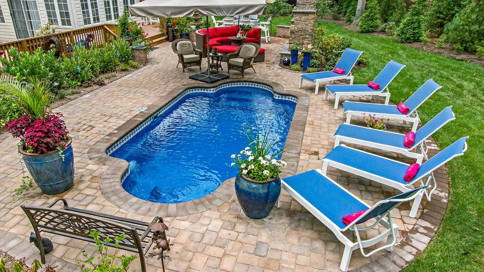 Leisure-Pools-Roman-fiberglass-pool The Roman, a fiberglass pool that offers facing seats at both ends