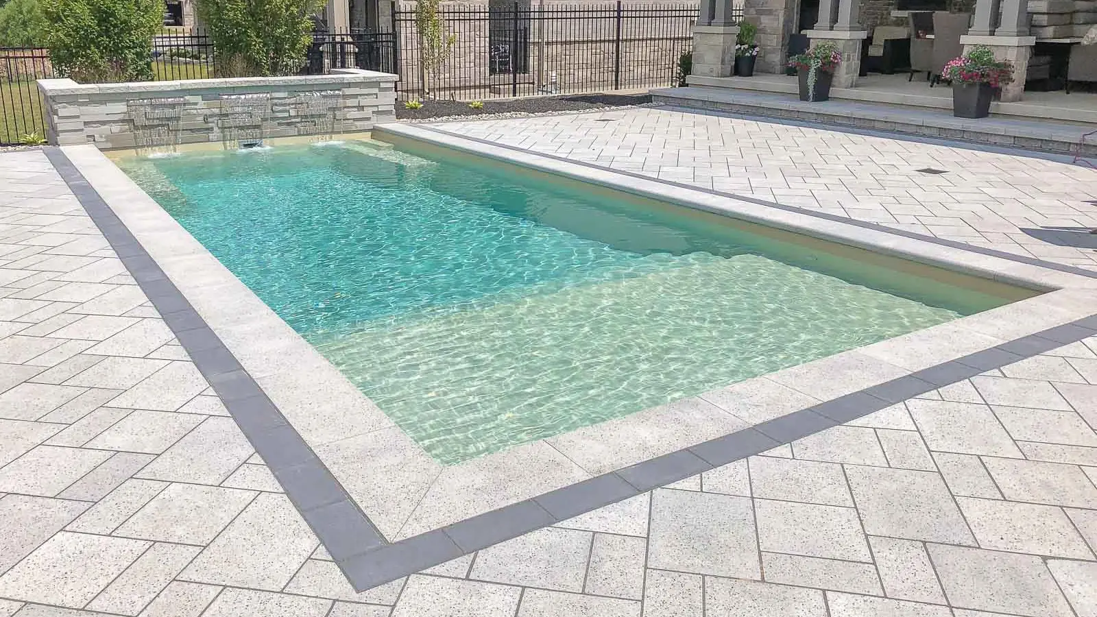 Leisure-Pools-Summit-fiberglass-pool The Summit, a fiberglass pool with a full width splash pad