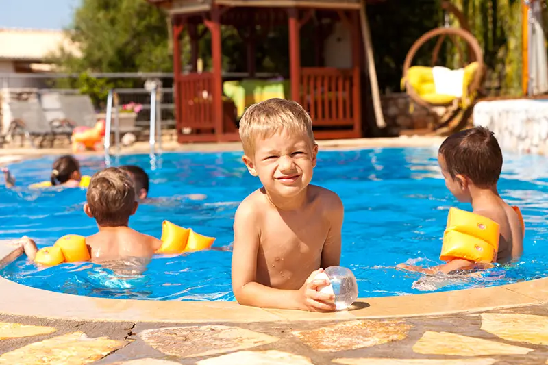 Pool Party Kids Kids back-to-school party at an inground fiberglass pool